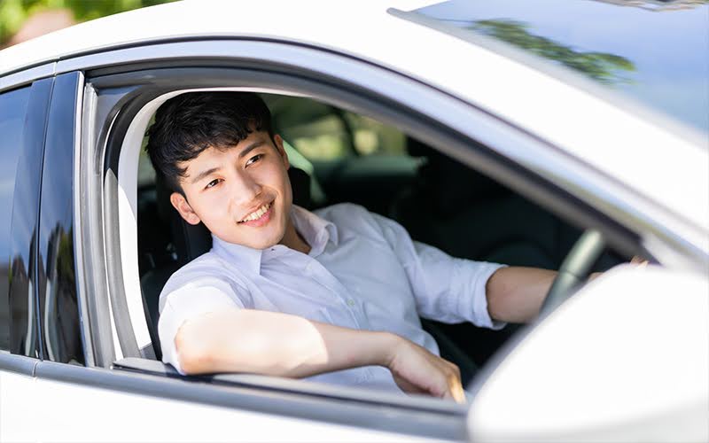 Businessman Driving A Car